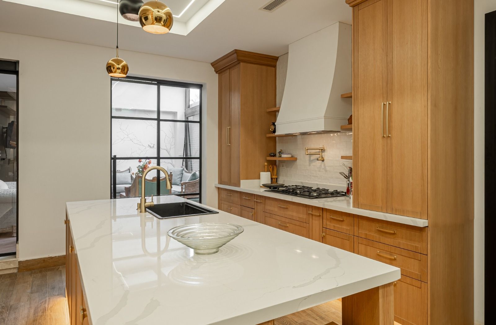 Oak and white stone kitchen by CAJA